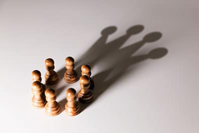 A group of pawn reflecting as a crown